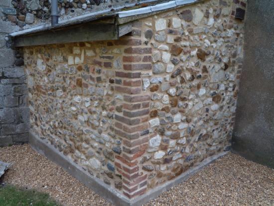 Refurbished wall to the rear of the toilet on the north side of St. Mary's, Holme-next-the-Sea